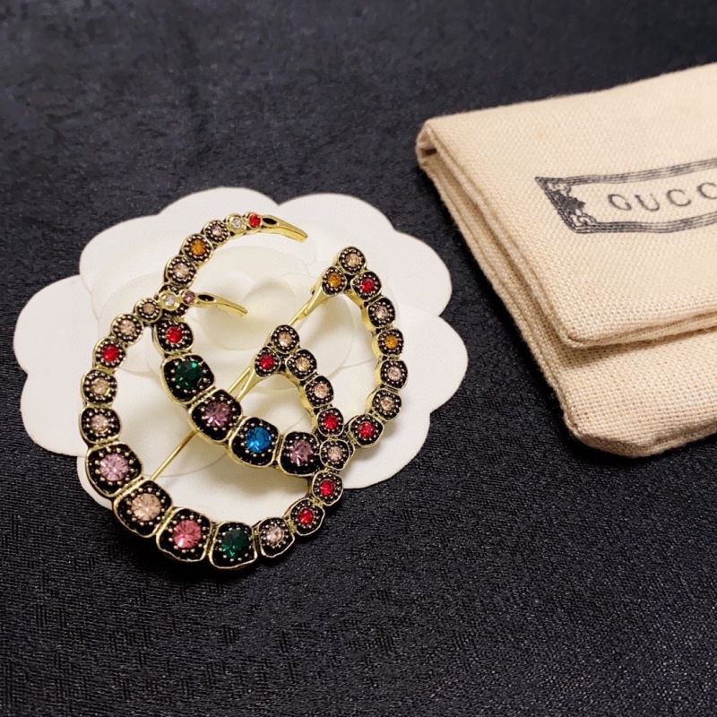 Gvc*1 brooches